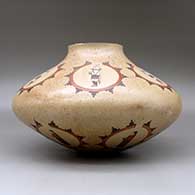 A large polychrome jar decorated with medallions of dancer and geometric design, click or tap to see a larger version
