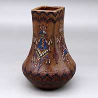 A polychrome low shouldered jar with a square neck and decorated with a sgraffito and painted yeibichai, feather and geometric design
 by Nancy Yazzie of Dineh