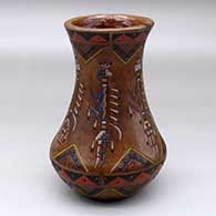 A polychrome low shouldered jar with a recurved neck and decorated with a sgraffito and painted yeibichai, feather and geometric design
 by Nancy Yazzie of Dineh