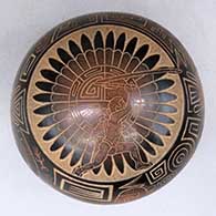 A red-and-sepia seed pot with a sgraffito warrior with an atlatl, Tularosa spiral, Barrier Canyon petroglyphs and geometric design
 by Dean Haungooah of Santa Clara