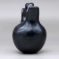 A black on black wedding vase with a two-panel geometric design, click or tap to see a larger version