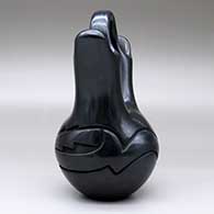 A black wedding vase with an avanyu design carved around the shoulder, click or tap to see a larger version