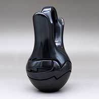 A black wedding vase with an avanyu design carved around the shoulder, click or tap to see a larger version