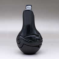 A black wedding vase with an avanyu design carved around the shoulder, click or tap to see a larger version