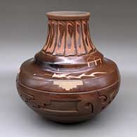 A brown double-shouldered jar decorated with a sgraffito-and-carved avanyu, feather, stylized avanyu and geometric design
 by Ryan Roller of Santa Clara