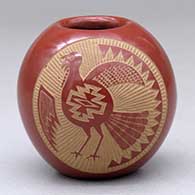 A red seed pot decorated with a sgraffito turkey and geometric design
 by Joseph Lonewolf of Santa Clara