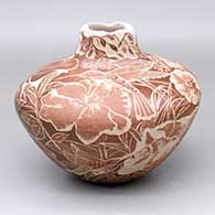 A red gourd-shaped jar with a squarish neck and decorated with a sgraffito hummingbird, flower and vine design
 by Bernice Naranjo of Taos