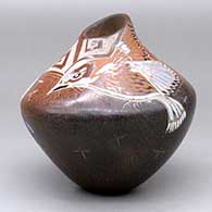 A brown jar decorated with a sgraffito and painted bird, dragonfly and geometric design
 by Dusty Naranjo of Santa Clara