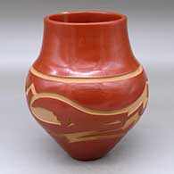 A red jar with an avanyu design carved around the shoulder
 by Sherry Tafoya of Santa Clara