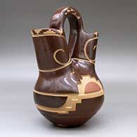 A polychrome wedding vase decorated with a carved and sgraffito kiva step and geometric design, click or tap to see a larger version