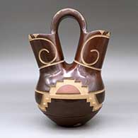 A polychrome wedding vase decorated with a carved and sgraffito kiva step and geometric design, click or tap to see a larger version