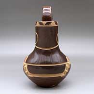 A polychrome wedding vase decorated with a carved and sgraffito kiva step and geometric design, click or tap to see a larger version