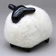 A black sheep figure with a wool body
 by Joe and Eunice Naranjo of Santa Clara