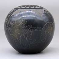 A black and sienna seed pot decorated with a sgraffito bear with two cubs in the mountains and geometric design, click or tap to see a larger version