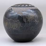 A black and sienna seed pot decorated with a sgraffito bear with two cubs in the mountains and geometric design, click or tap to see a larger version