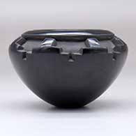 A small black bowl carved with a band of kiva step geometric design around and above the shoulder, click or tap to see a larger version