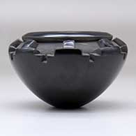 A small black bowl carved with a band of kiva step geometric design around and above the shoulder, click or tap to see a larger version