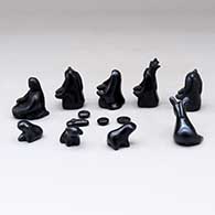 A black on black nativity set with 13 pieces, click or tap to see a larger version