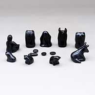 A black on black nativity set with 13 pieces, click or tap to see a larger version