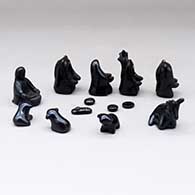 A black on black nativity set with 13 pieces, click or tap to see a larger version