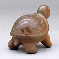 A sienna turtle with a sgraffito feather design on its shell, click or tap to see a larger version