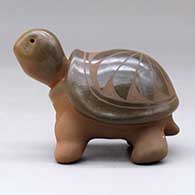 A sienna turtle with a sgraffito feather design on its shell, click or tap to see a larger version