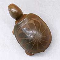 A sienna turtle with a sgraffito feather design on its shell, click or tap to see a larger version