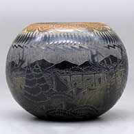 A black bowl with a sienna rim and a sgraffito koshare, wildlife, avanyu, feather and geometric design, click or tap to see a larger version