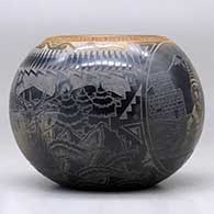 A black bowl with a sienna rim and a sgraffito koshare, wildlife, avanyu, feather and geometric design, click or tap to see a larger version