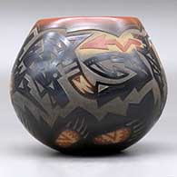 A black jar with a sienna rim and spots, an inlaid stone and a sgraffito avanyu, bear paw and geometric design, click or tap to see a larger version