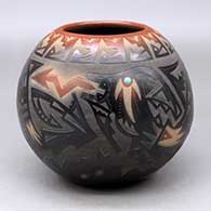 A black bowl with a sienna rim and spots, decorated with a sgraffito avanyu and geometric design with an inlaid stone
 by Sammy Naranjo of Santa Clara