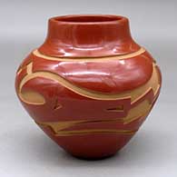 Click for a larger view A polished red jar decorated with a carved avanyu and geometric design around the shoulder
by Sherry Tafoya of Santa Clara
