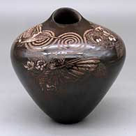Click for a larger view A dark brown high shouldered jar with an organic opening and decorated around the shoulder with a sgraffito hummingbird, nest, flower, branch, leaf and spiral geometric design
by Johnathan Naranjo of Santa Clara