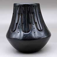A tall neck black jar decorated with a carved kiva step and geometric design around the neck, click or tap to see a larger version