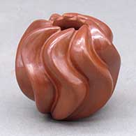 A miniature red melon jar carved with 8 ribs
 by Nancy Youngblood of Santa Clara