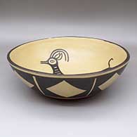 Large polychrome dough bowl with a Mimbres goat design on inside and a geometric design on outside, click or tap to see a larger version