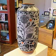 A tall polychrome jar decorated with three bands of fish, bird, flower and geometric design
 by Thomas Tenorio of Santo Domingo