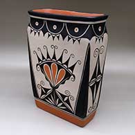 A rectangular polychrome jar decorated with a four-panel cotton flower and geometric design
 by Thomas Tenorio of Santo Domingo