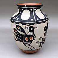 A polychrome jar with a flared rim and decorated with a 2two-panel bird  and flower design below the shoulder and an eight-panel geometric deign above the shoulder
 by Thomas Tenorio of Santo Domingo