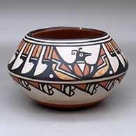 A polychrome jar decorated with a fish and hand design inside and a three-panel bird, feather and geometric design outside
 by Robert Tenorio of Santo Domingo