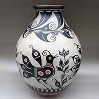 A large polychrome jar decorated with a bird, plant and geometric design
 by Thomas Tenorio of Santo Domingo