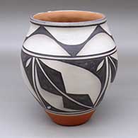 A polychrome jar with a flared rim and decorated with a four panel geometric design
 by Ambrose Atencio of Santo Domingo