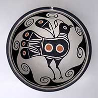 A polychrome chili bowl decorated with a bird and geometric design inside, and a geometric design outside
 by Thomas Tenorio of Santo Domingo