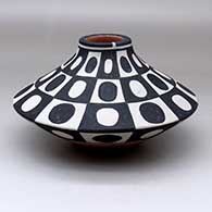 A polychrome low-shoulder jar decorated with a checkerboard and geometric design
 by Thomas Tenorio of Santo Domingo