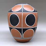 A polychrome jar decorated with a geometric design, click or tap to see a larger version