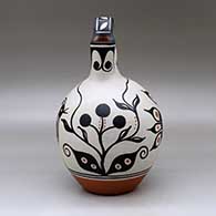 A polychrome wedding vase decorated with a four-panel bird, flower and geometric design, click or tap to see a larger version