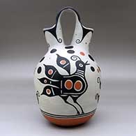 A polychrome wedding vase decorated with a four-panel bird, flower and geometric design, click or tap to see a larger version