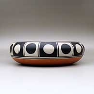 A large, shallow polychrome bowl decorated inside with a bird, wave and geometric design, and decorated around the shoulder with a band of geometric design, click or tap to see a larger version