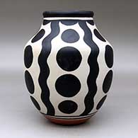 A polychrome jar decorated with a four-panel geometric design, click or tap to see a larger version