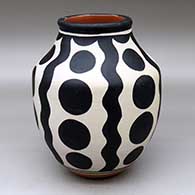 A polychrome jar decorated with a four-panel geometric design
 by Thomas Tenorio of Santo Domingo